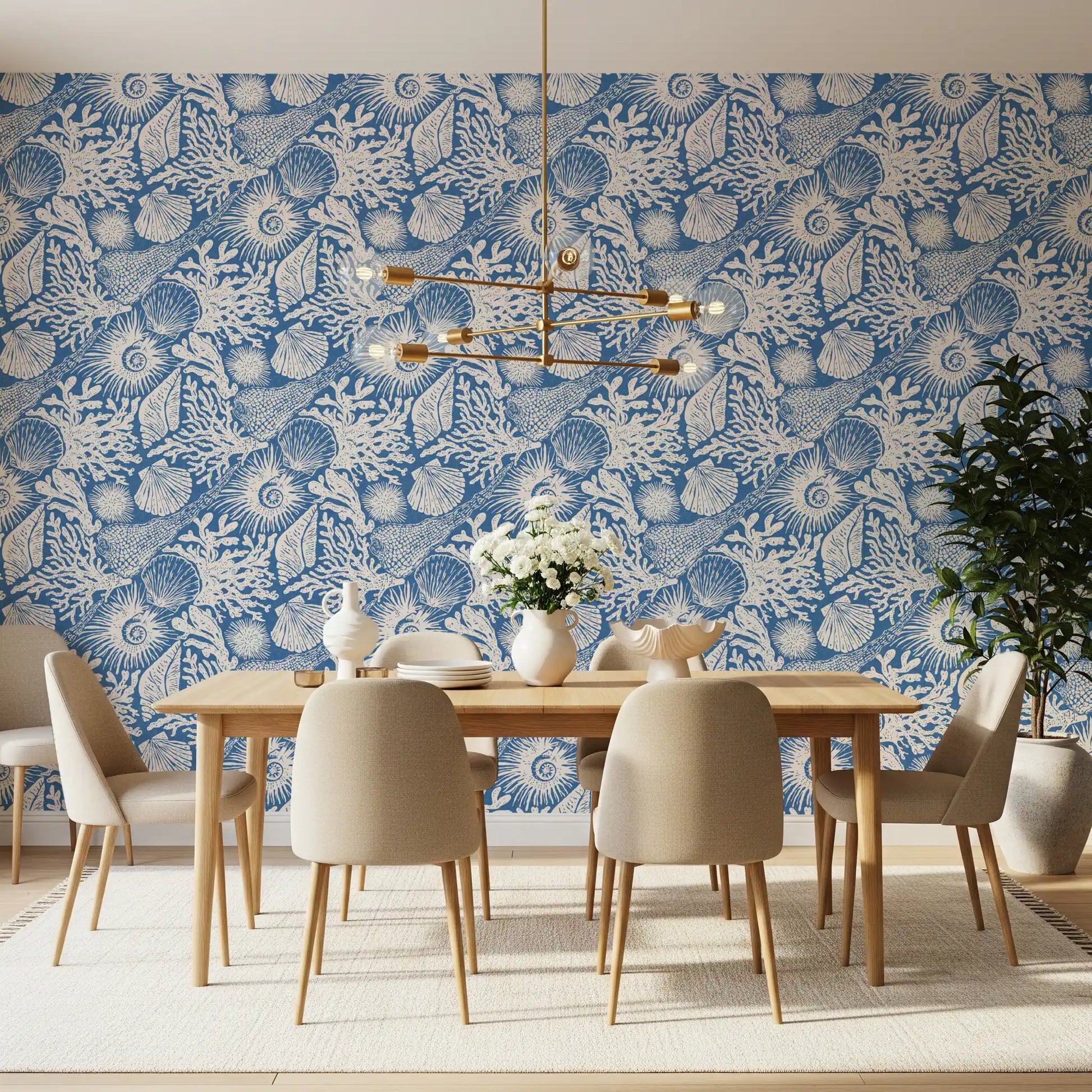 Detailed sea urchin and fan shell forms in the bright blue coastal wallpaper