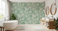 Ivory scallop shells and coral fans set against soft aqua green wallpaper