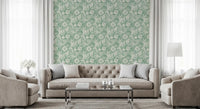 Cosy lounge corner styled in soft aqua green seashell wallpaper