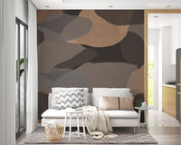 Living room wall mural with earthy pebble shapes and warm sepia tones