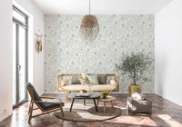 Calm living room lined with green linework floral wallpaper