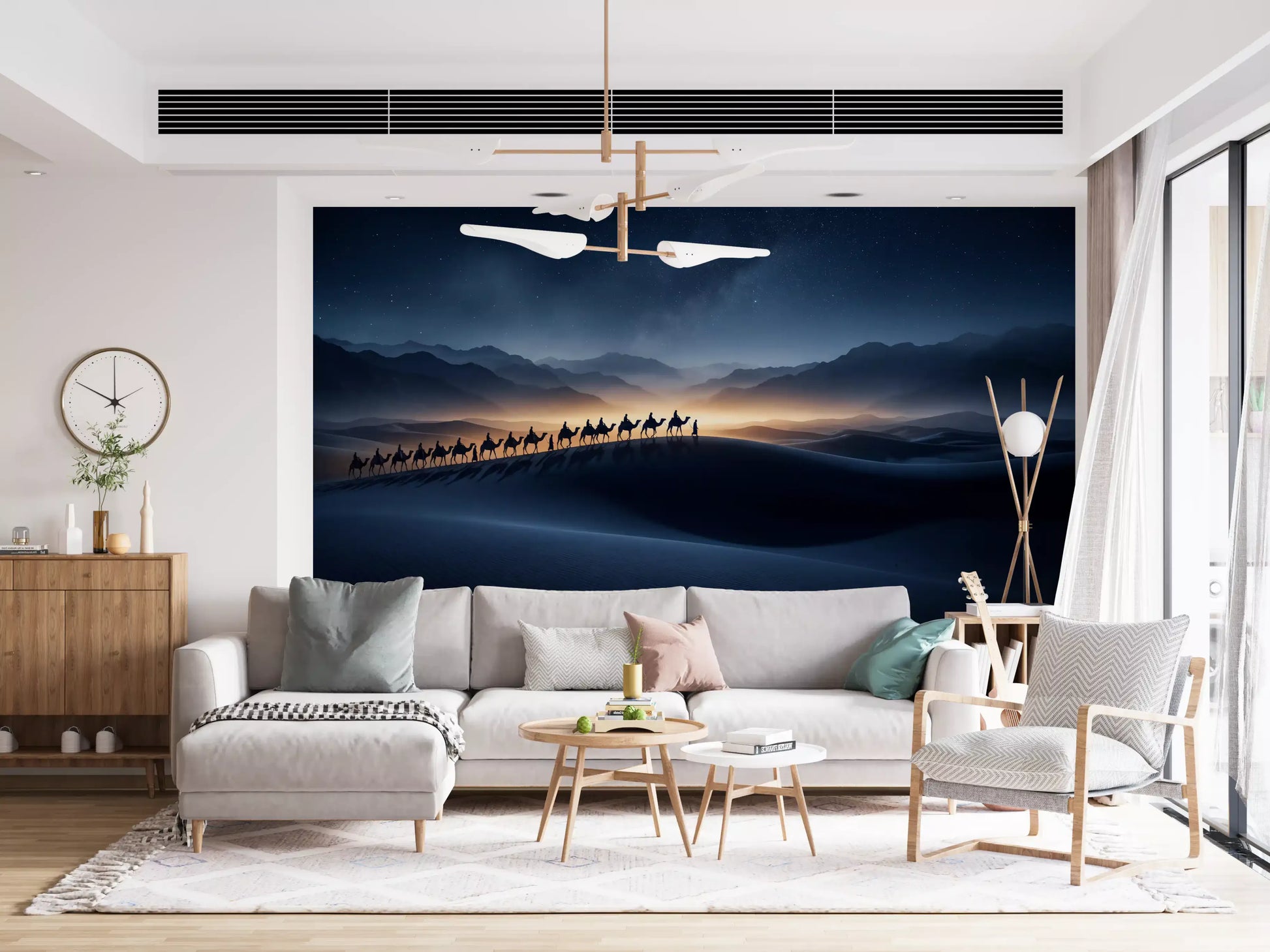 Living room backdrop showing Desert Odyssey wall mural with moonlit dunes