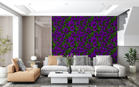 Twisting green leaves frame the purple flowers in this clematis vine wallpaper