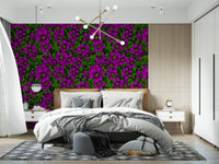 Bedroom corner glowing beside pink clematis floral wallpaper