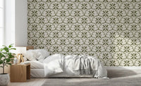Sage daisy motifs in Tuscany Scallop Olive wallpaper give a quiet bedroom slow charm.