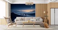 Moonlit horsemen cross silvery dunes in a family room set with Desert Riders wall mural