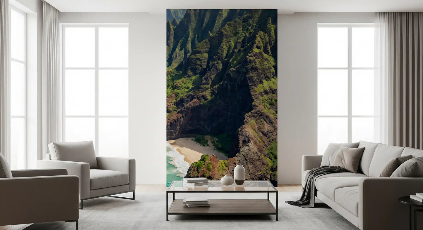 Na Pali Coast: Emerald Cliffs & Azure Sea Wall Mural displayed within a living room.