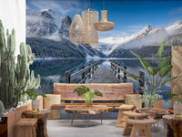 Wooden café and restaurant siting area by a winter mountain wall mural.