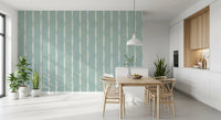 Elegant dining room highlighting a soft blue textured wallpaper with vertical lines.