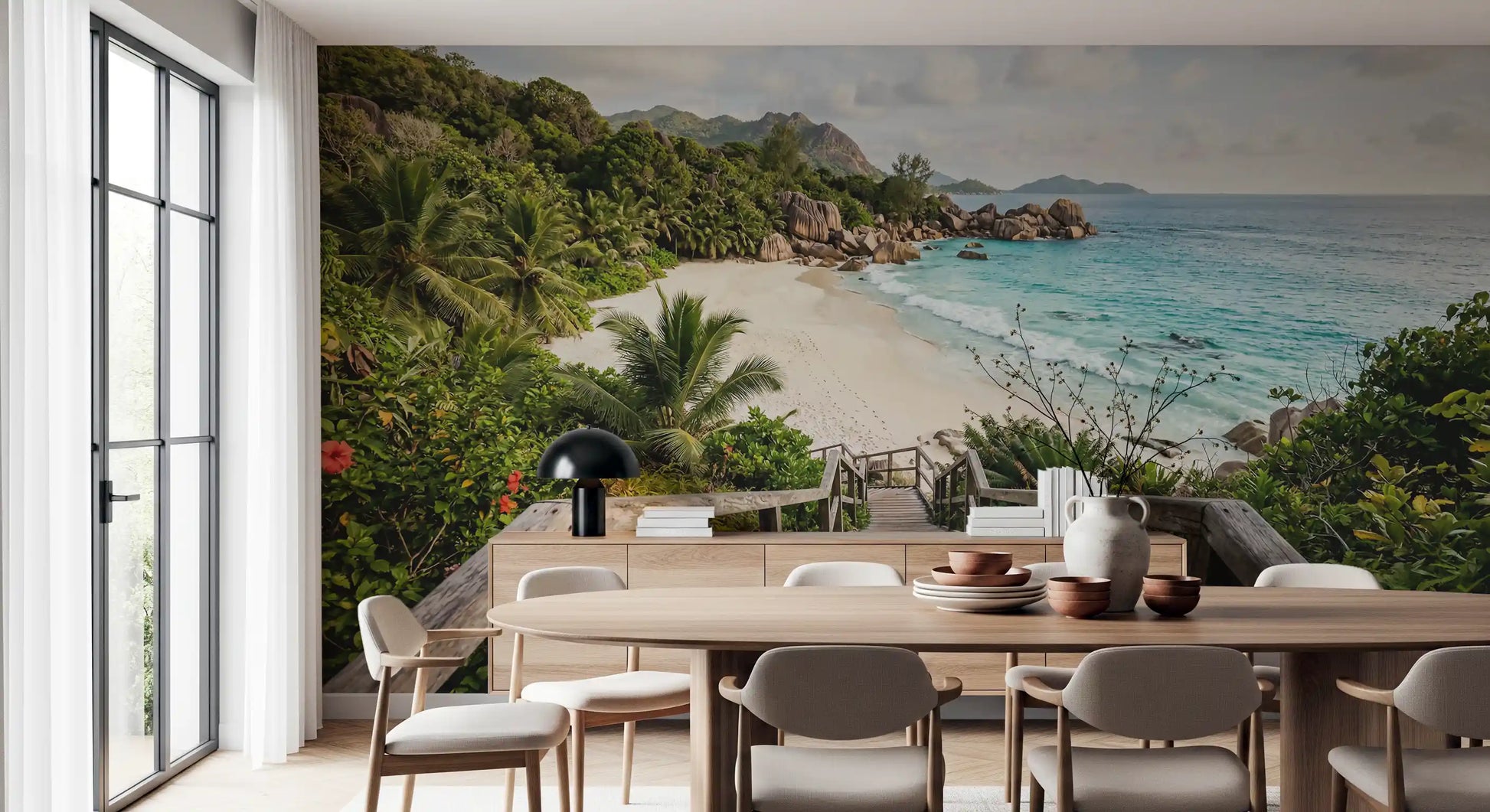 Sunlit palms and surf frame a dining room with the Turquoise Shores wall mural