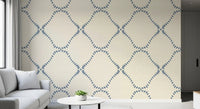 A slate-blue diamond trellis warms the lounge in this Beachy Boho wallpaper.
