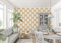 Tiny gold dots wrap around large ovals in this mosaic wallpaper