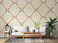 Slightly uneven dabs keep this Golden Dotted wallpaper loose and casual.