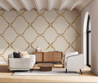 Easy boho warmth reaches a kitchen-Living space via this Golden Lattice wallpaper.
