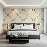 Amber dots and cream linen dress an Bedroom in Golden Lattice wallpaper.