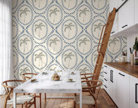 Repeating palm medallions frame this dining room in beachy boho slate-blue wallpaper