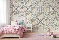 Sage-green palm trees rise at the centre of each blue medallion in this wallpaper