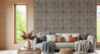 Neutral sitting area backed by the dark charcoal brown fan wallpaper pattern