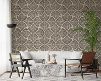 Cozy sitting space perfectly complemented by a minimalist wallpaper