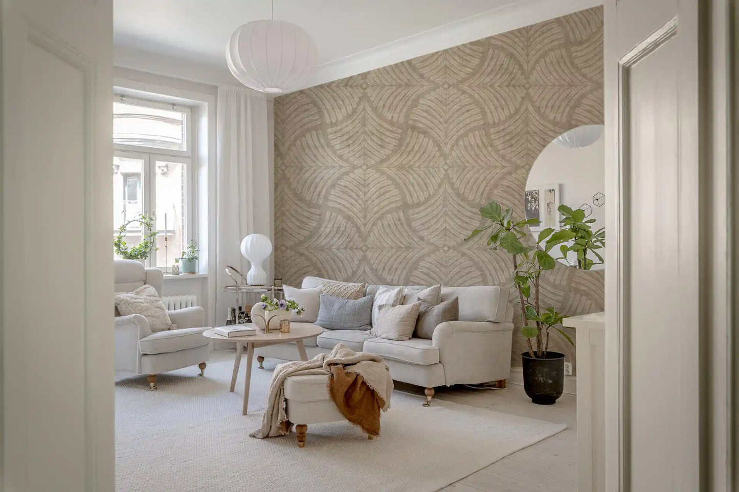 Gentle fan motifs ground a Living room in the Japandi Scallops Fan wallpaper tone.