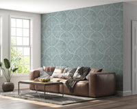 Easy lounge mood from feathered blue fan scallop wallpaper on a pale ground