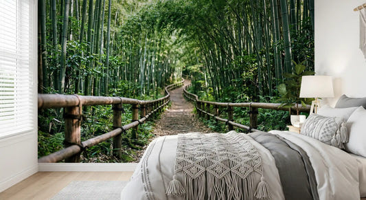 Tall green bamboo calms this bedroom through a serene forest wall mural scene.
