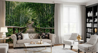 Bamboo forest path wall mural shows a winding trail between tall green stalks.
