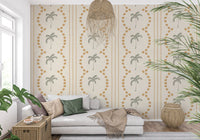 A cozy living room backdrop utilizing the Tropical Palm Deco Stripes Sand Wallpaper.