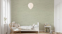 Woven cream texture warms the muted green in this Zellige Ornament wallpaper