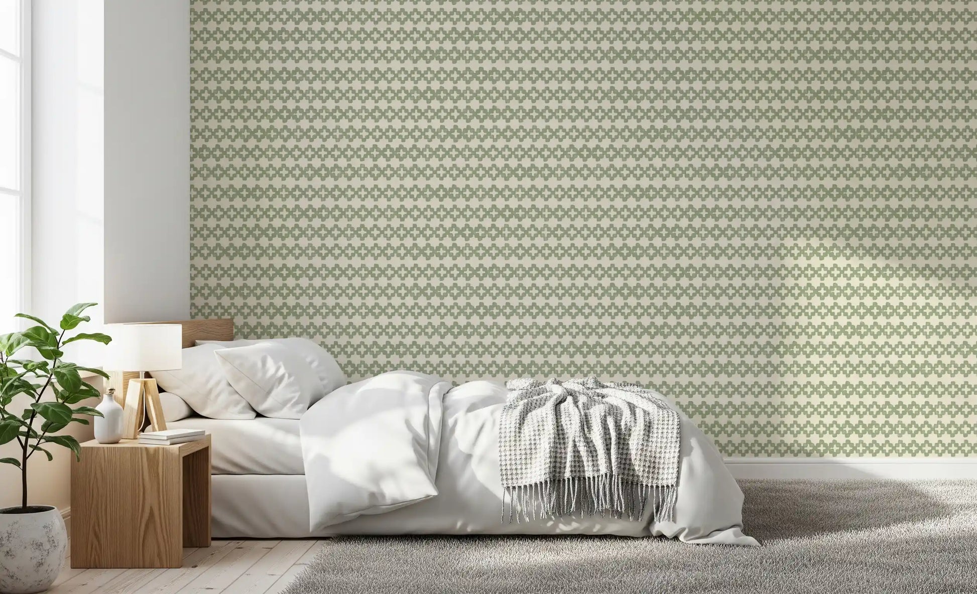 Plus-shaped motifs repeat in even rows on the Zellige Cross green wallpaper.