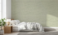Plus-shaped motifs repeat in even rows on the Zellige Cross green wallpaper.