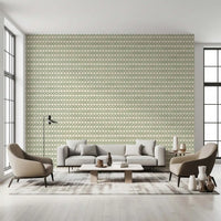 Quiet bedroom backdrop in the Zellige Cross Ornament coastal green wallpaper.