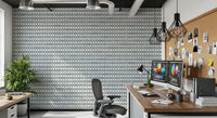 Blue cross motifs stacked in tidy bands over creamy zellige wallpaper
