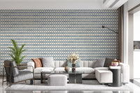 Tiled blue cross motifs lend a quiet living room a creamy zellige wallpaper look
