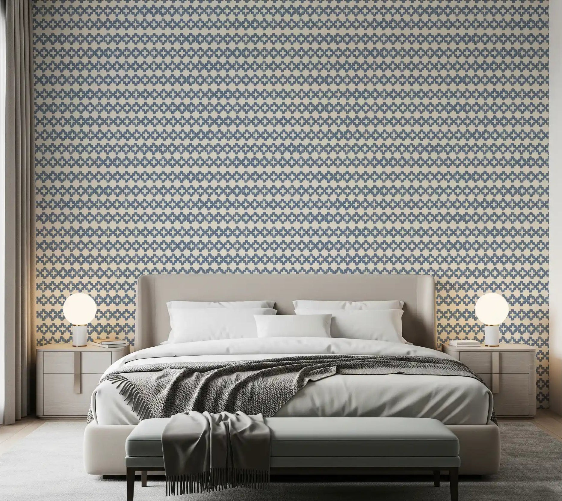 Bedroom dressed in slate blue zellige cross wallpaper over a creamy ground