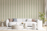 Cream linen ground meets muted green zellige stripes wallpaper with woven texture.