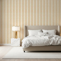 Cream and gold zellige wallpaper sets a relaxed mood in this Bedroom area.