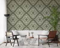 Muted green canvas wallpaper detailing an organic ornament look in ivory