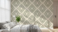 Concentric rings of pebble dots build the palm green ornament wallpaper motif