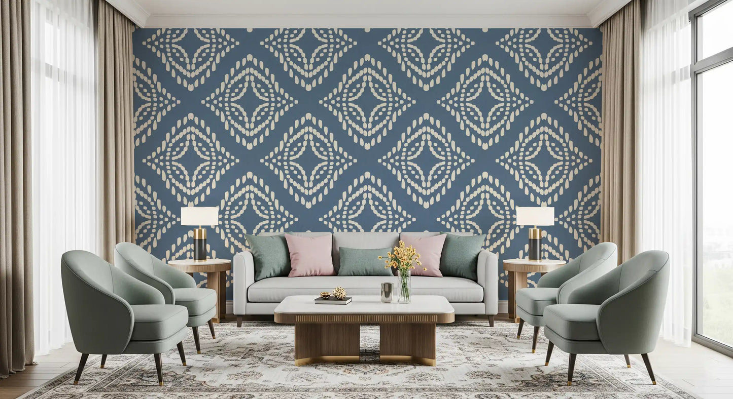 A bold slate blue ornament wallpaper keeps this living room grounded and calm