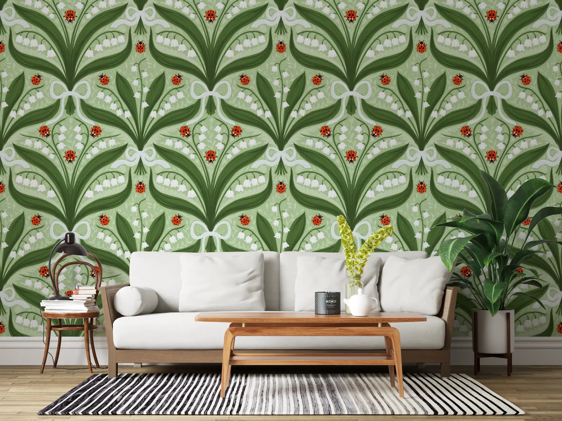 Cool green, crisp white and bright red balance the symmetrical lily wallpaper