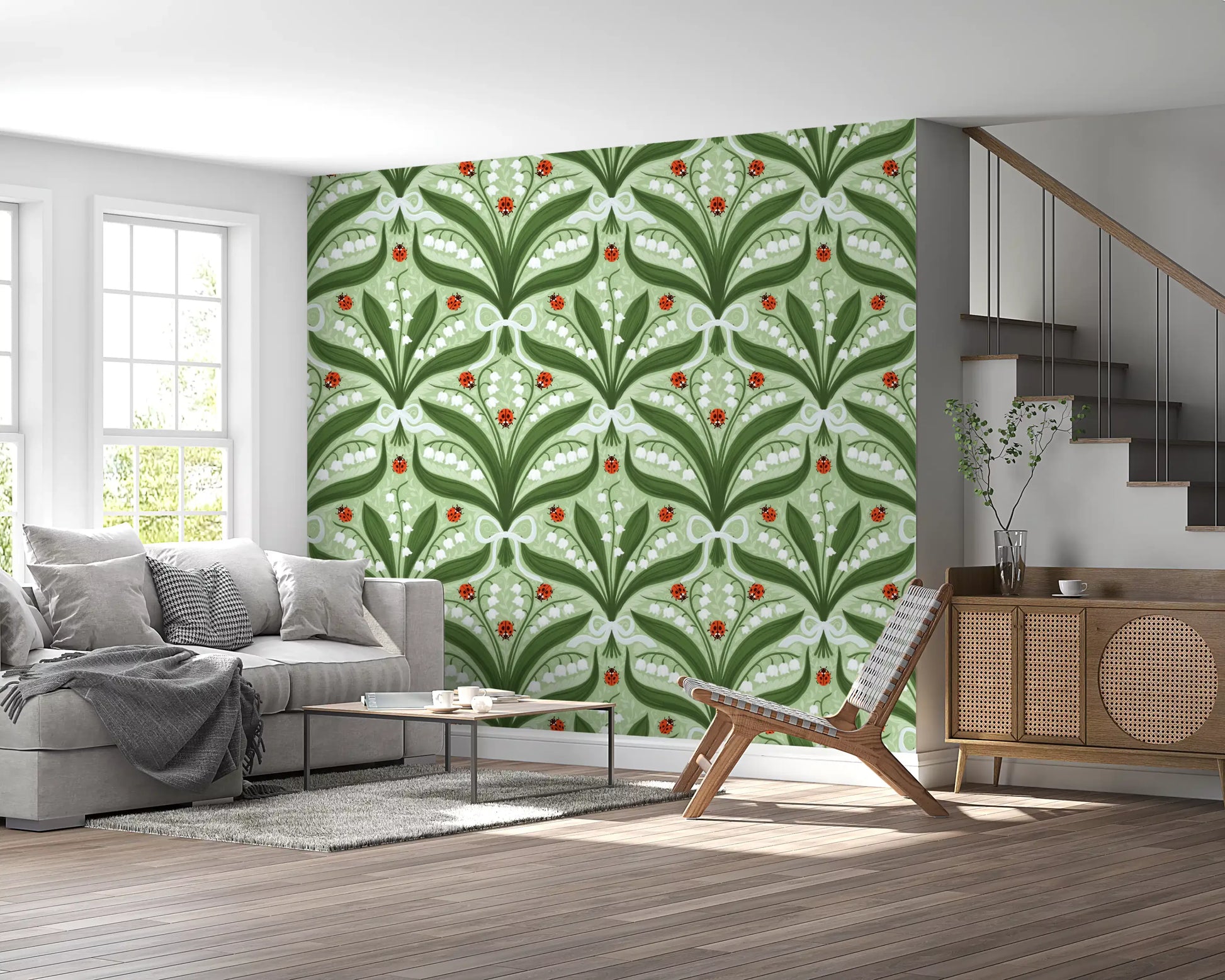 Lily of the valley ladybug wallpaper with white bells on a sage green ground