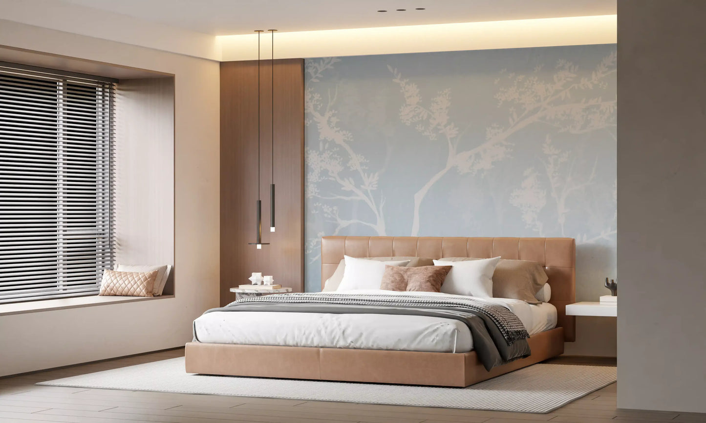 White branches and pale blue haze dress an Bedroom in Blossom wall mural.