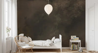 Faded branches and fog quiet the bedroom in this moody wall mural