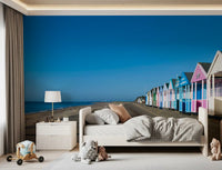 Coastal promenade view freshens a bathroom in this Colorful Beach Hut wall mural