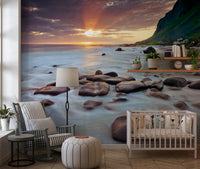 Glowing ocean light gives a Nursery a serene Coastal Sunset wall mural
