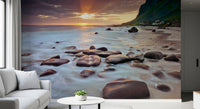 Misty surf slides between sea-worn boulders in this coastal wall mural