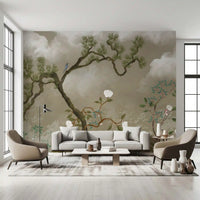 Gnarled pine trunk twisting upward through the cloud-filled chinoiserie wall mural
