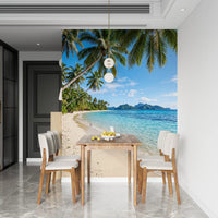 Gentle white foam edges the sand line shown in the Tropical Beachside Serenity wall mural