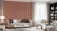 Cream-on-rust triangle mudcloth wallpaper behind a small Living nook